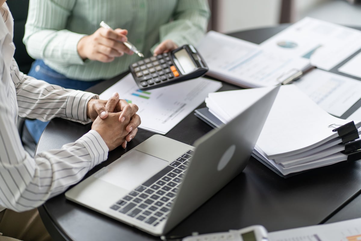 Charity accountant reviewing SORP 2026 fund accounting statements showing restricted unrestricted designated and endowment charity funds