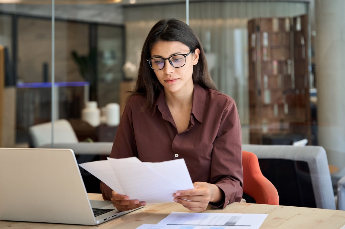 CIC Companies House filing, professional accountant reviewing financial filing documents on a laptop
