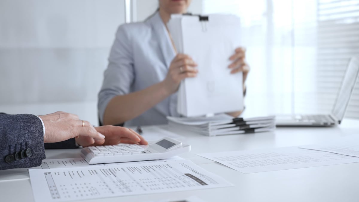 Community Interest Company annual accounts preparation services, accountants reviewing financial documents and calculations for a CIC