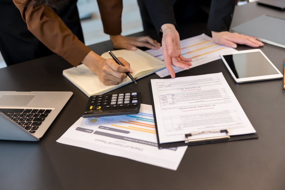CIC annual accounts preparation services, specialist accountants reviewing Community Interest Company financial reports at a modern office table